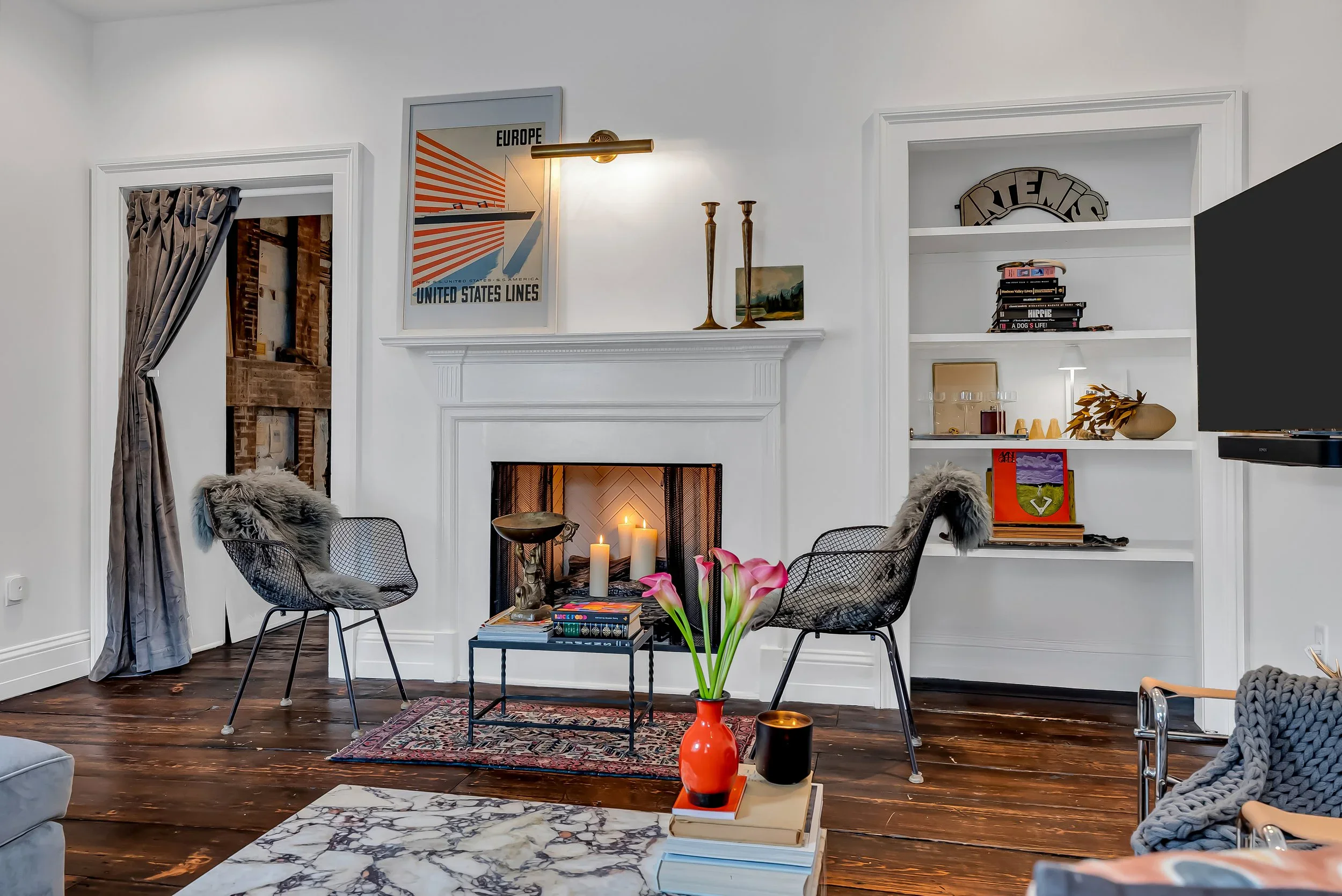 Light-filled living room with collected art and comfortable seating